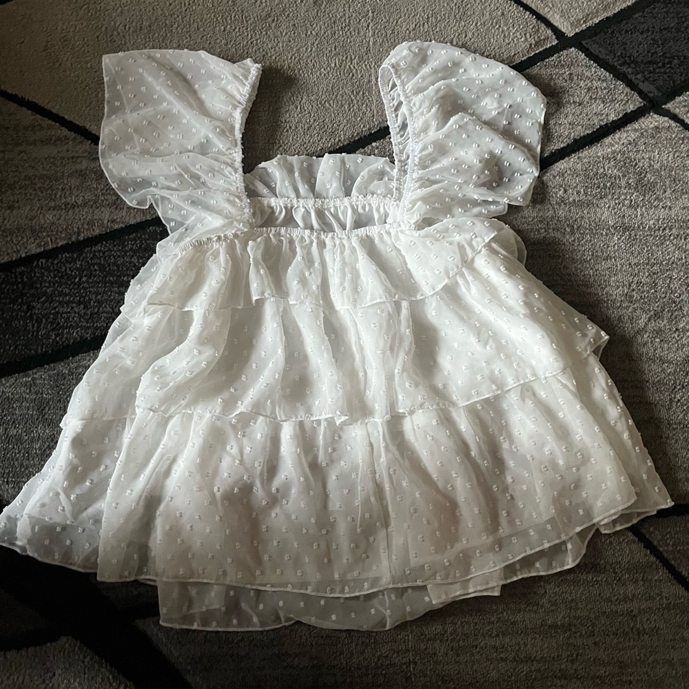 Super cute white top! Flowy and has white poka dots! Never worn, size 12! SHEIN